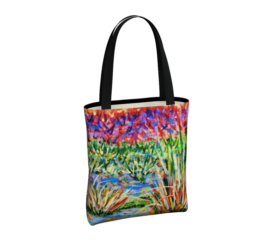 Tote bag with a colorful nature-themed design on a light gray background