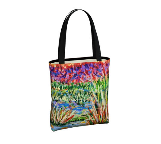 Tote bag with a colorful nature-themed design on a light gray background
