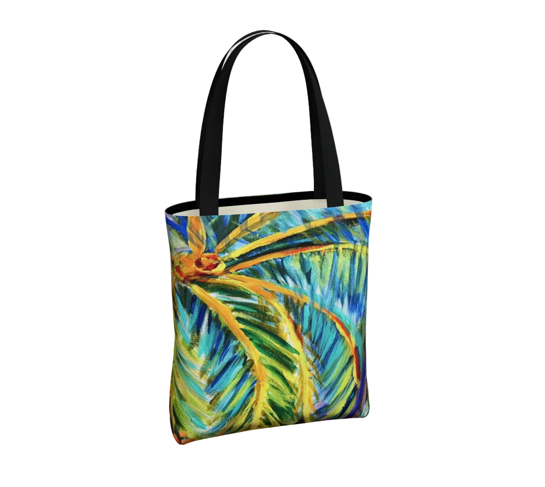 Tote bag with tropical leaf design on a white background