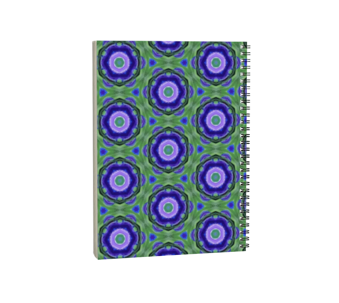 Notebook with a green and purple circular pattern on a white background