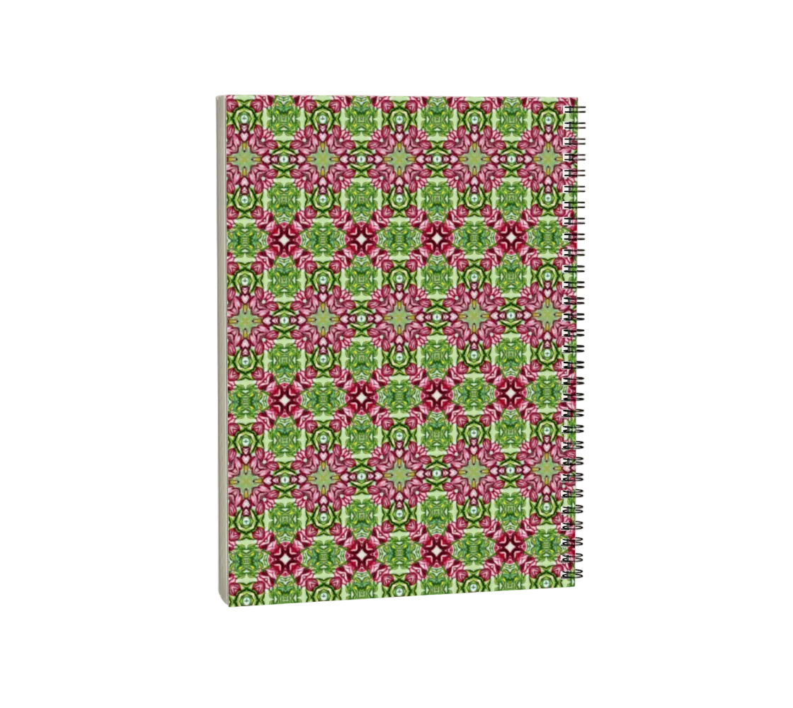 Notebook with a pink and green geometric pattern on a white background