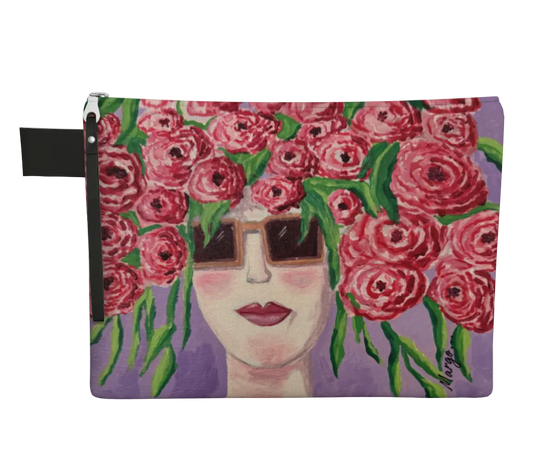 Pouch with a design of a face surrounded by pink flowers on a purple background