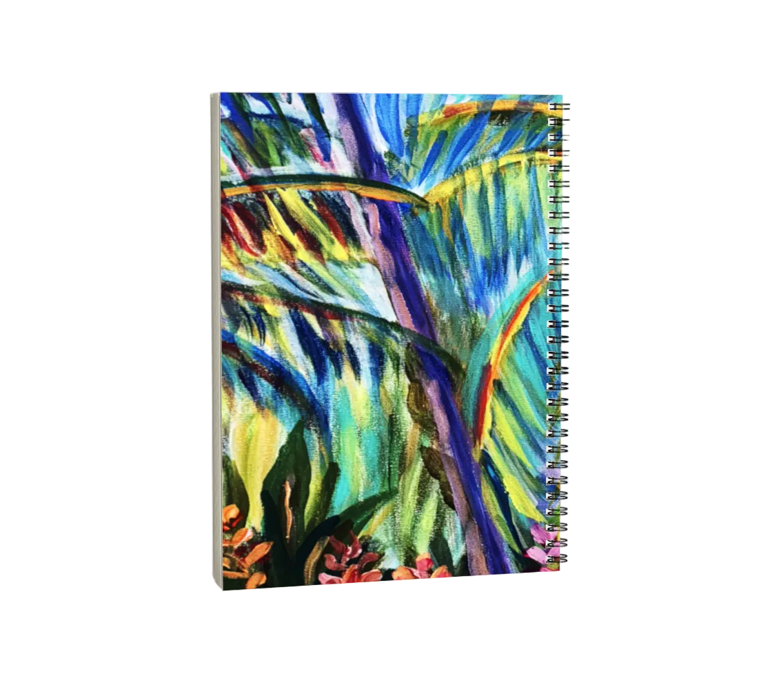 Notebook with a colorful tropical leaf design on a white background
