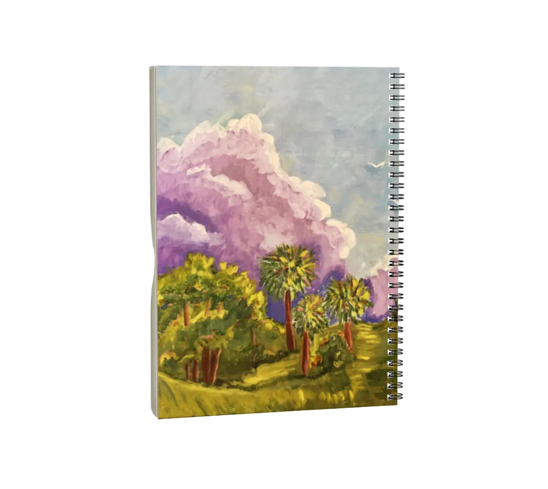 Notebook with a colorful landscape design on the cover