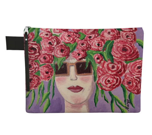 Pouch with a design of a face surrounded by pink flowers on a purple background