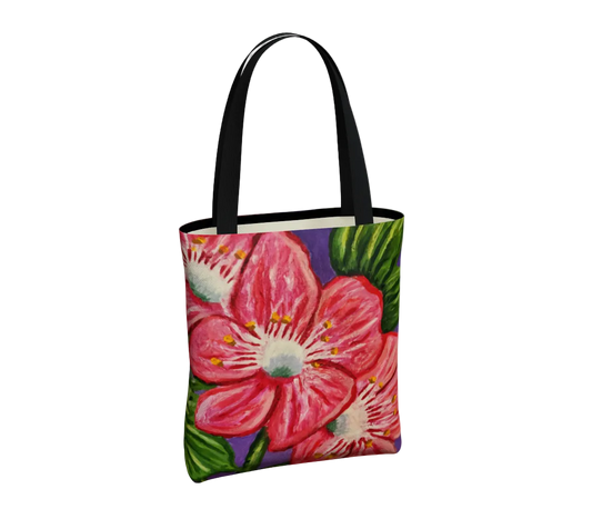 Tote bag with pink floral design on a white background