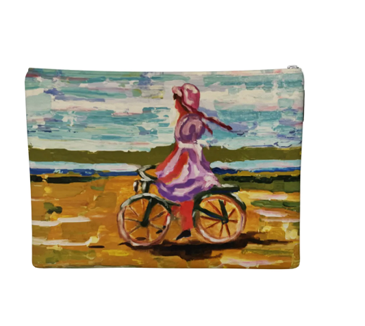 Pouch with a painting of a girl on a bicycle in a field