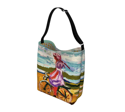 Colorful tote bag with a cyclist design on a white background