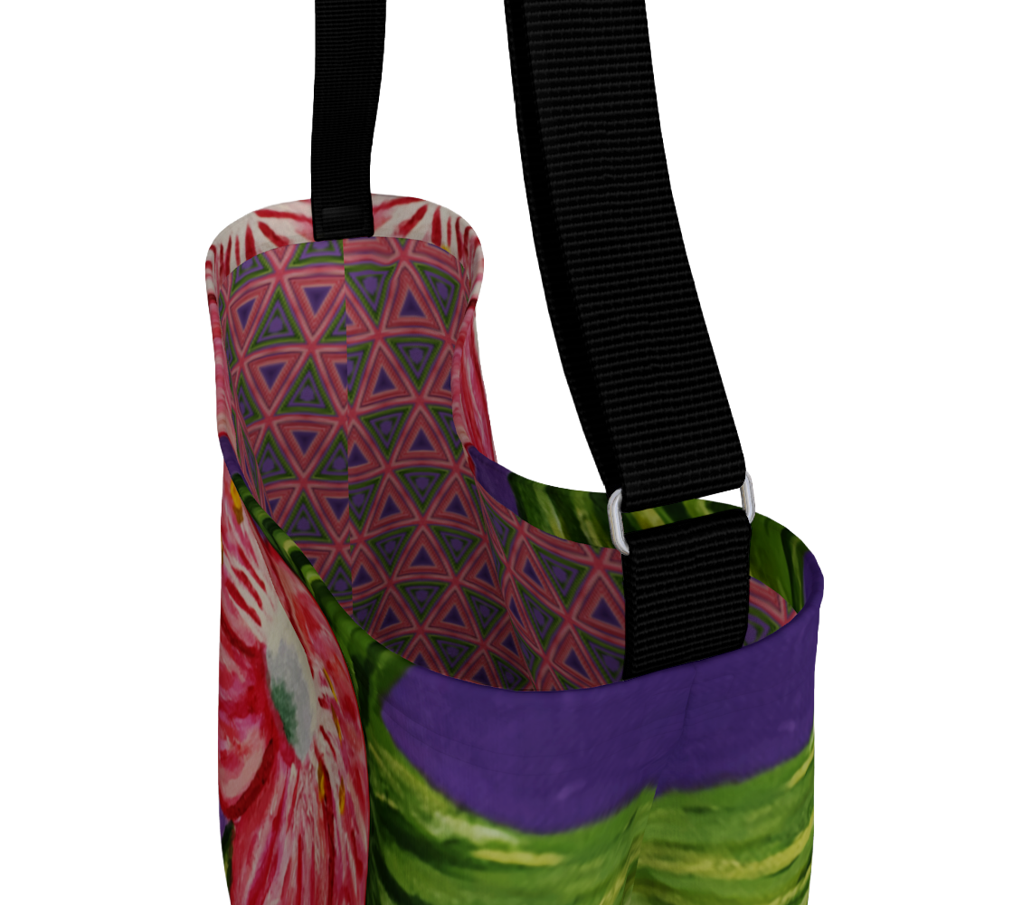A tote bag with a vibrant multicolor print featuring a pink and green floral pattern, a purple and green abstract section, and a geometric triangle design on the interior lining. It has a black shoulder strap with silver metal hardware, shown against a plain white background.
