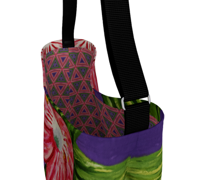 A tote bag with a vibrant multicolor print featuring a pink and green floral pattern, a purple and green abstract section, and a geometric triangle design on the interior lining. It has a black shoulder strap with silver metal hardware, shown against a plain white background.